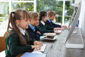 students using computers in school