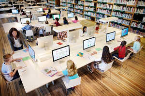 classroom with students using a desktop computers classroom with students using a desktop computers