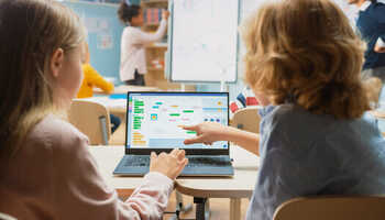 girl using a laptop in the classroom