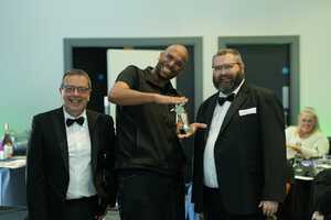 Tito at Computeam receiving an award