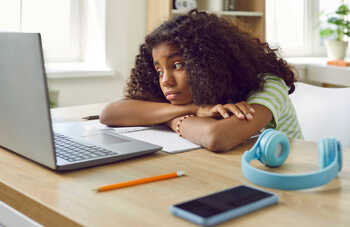 girl using a laptop in the classroom