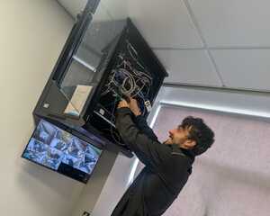 A Computeam IT professional at work at Manor Hall Academy Trust