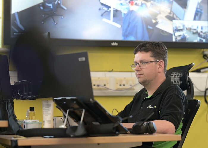 teacher helping students with IT work